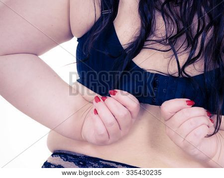 Woman Back View Putting On Her Bra Lingerie.
