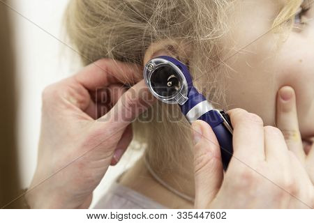 Doctor Checks The Child’s Ear