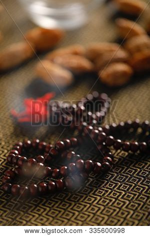 Date Fruits With An Islamic Prayer Beads On An Artistic Background. Beautiful Background For Ramzan 