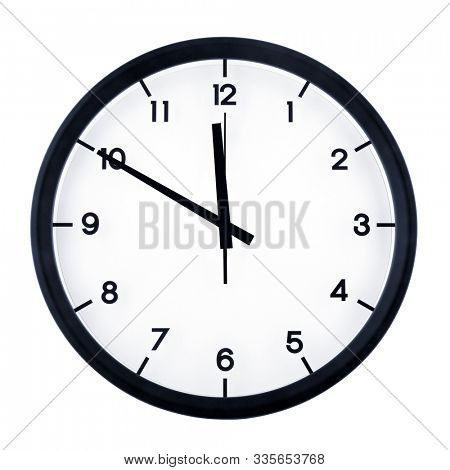 Classic analog clock pointing at eleven fifty, isolated on white background.
