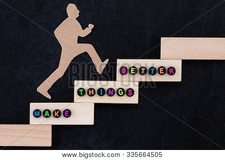 Make Things Better - Improvement Concept. Paper Man Climbing The Steps To Success In A Conceptual Im