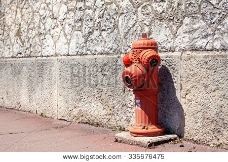 Closeup Typical Red Fire Hydrant On Street, Outdoor. Plumbing For Fire Hydrant On Public Footpaths