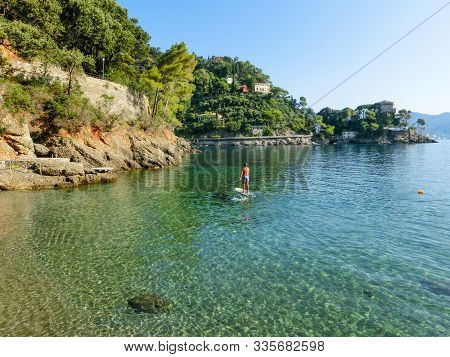 The Sand Beach Known As Paraggi Near Portofino In Genoa On A Blue Sea Background
