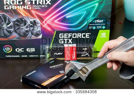 Minsk, Belarus - November 25, 2019: A Man Examines The Components For Assembling A Gaming Computer,