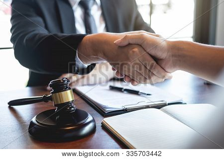 Handshake After Good Deal Negotiation Cooperation, Professional Male Lawyer Or Counselor And Client 