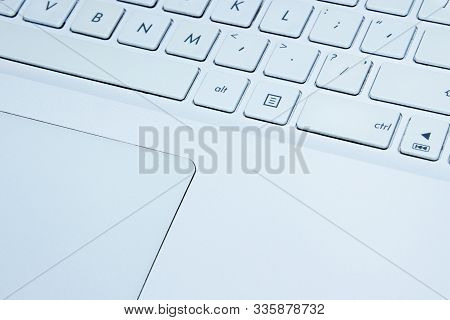 Blurred Image Of White Laptop Kayboard,  Close Up.  Laptop, Technology Concept.