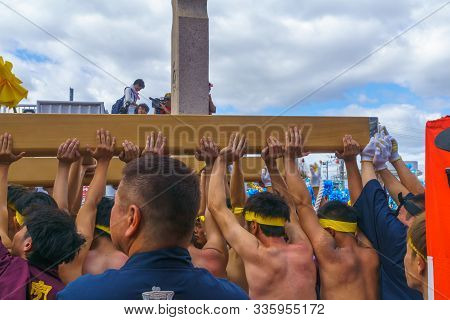 Himeji, Japan - October 15, 2019: Portable Shrine Lifted By Men In Traditional Dressing, And Crowd. 
