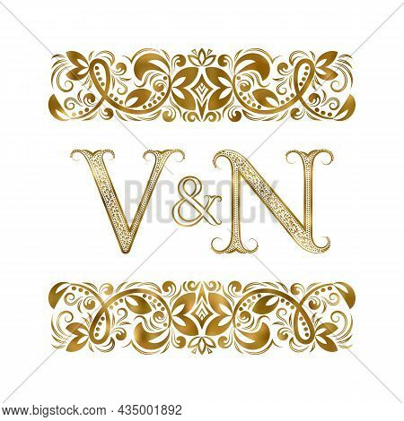 V And N Vintage Initials Logo Symbol. The Letters Are Surrounded By Ornamental Elements. Wedding Or 