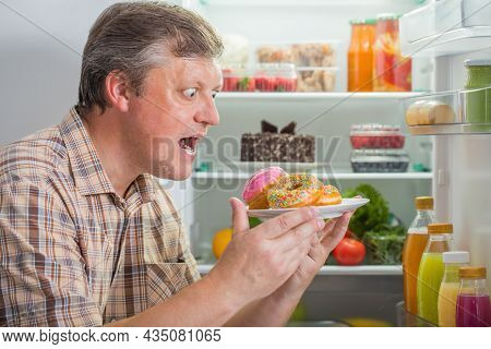 The Mature Men At Fridge  With Food