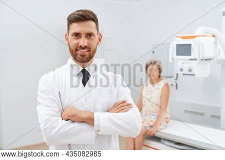 Front View Of Confident Doctor In White Uniform With Crossed Hands After Success Day After Diagnosti