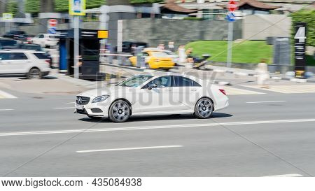 Mercedes-benz Cls 500 4matic Car  Is Moving Along The Street With Blurred Urban Background. Moscow, 