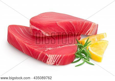 Fresh Tuna Fish Fillet Steak With Rosemary And Lemon Isolated On White Background With Clipping Path