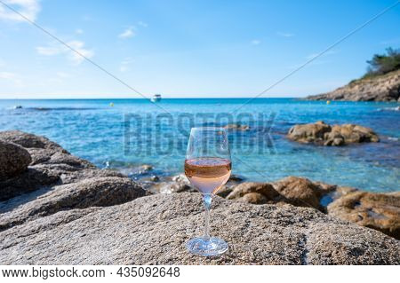 Summer Time In Provence, Glass Of Cold Rose Wine On Sandy Beach And Blue Sea Near Saint-tropez, Var