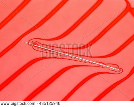Physical experiment - needle floats on water surface.