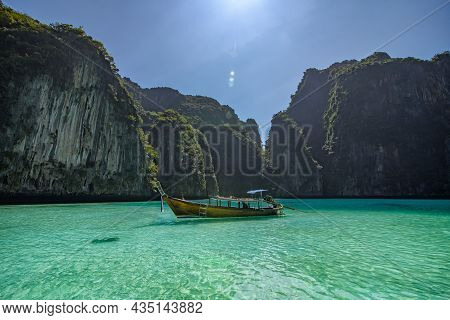 The Scenery Of A Lone Long Boat And Rocks On Pileh Lagoon In Krabi, Thailand