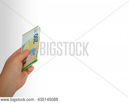 Closeup Hand Extended From Top To Bottom,giving Money,two,one Hundred Euro Bill Wad,white Background