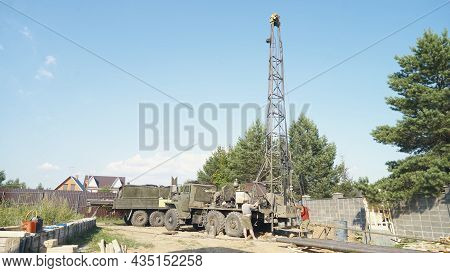 Moscow, Russia - Jule 9 2021: Water Well Drilling Rig, Drill Is Digging A Hole, Holes Boring In Grou