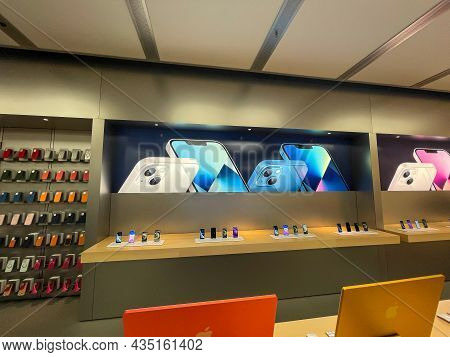 Cologne, Germany - October 01st 2021: A German Photographer Comparing And Testing The New Iphone 13 