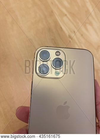 Cologne, Germany - October 01st 2021: A German Photographer Comparing And Testing The New Iphone 13 