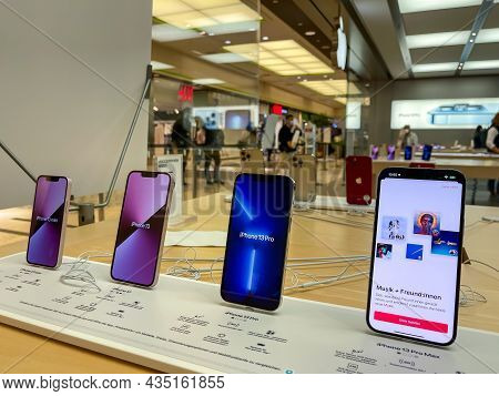 Cologne, Germany - October 01st 2021: A German Photographer Comparing And Testing The New Iphone 13 
