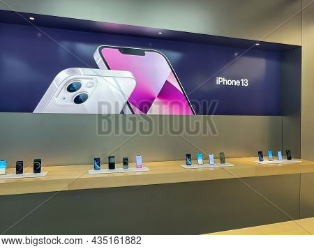 Cologne, Germany - October 01st 2021: A German Photographer Comparing And Testing The New Iphone 13 
