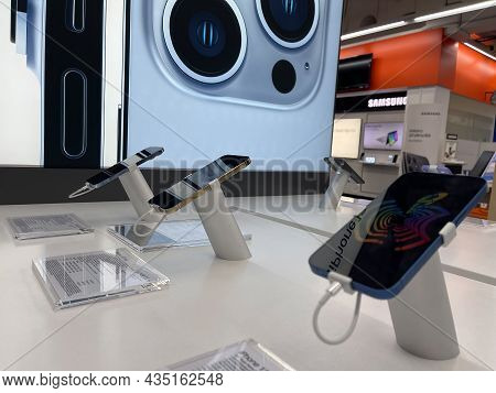 Frankfurt, Germany - October 04th 2021: A German Photographer Comparing And Testing The New Iphone 1