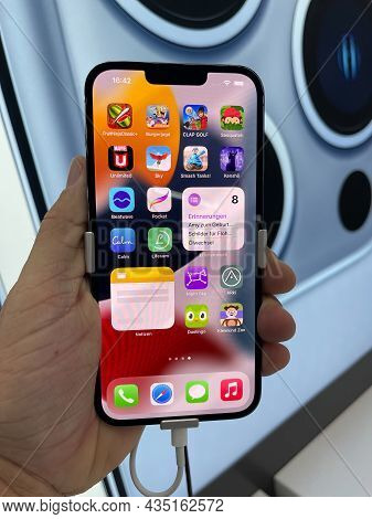 Frankfurt, Germany - October 04th 2021: A German Photographer Comparing And Testing The New Iphone 1