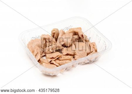 The Artificial Soy-based Meat Chicken Style Chunks In A Plastic Tub Isolated On A White Background.
