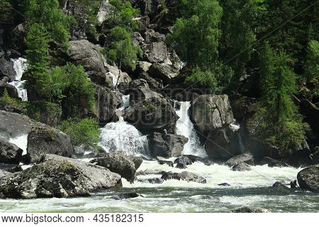 A Stormy Stream Of Water Of The Uchar Waterfall Descends On Huge Stones And Flows Into The River, Tr