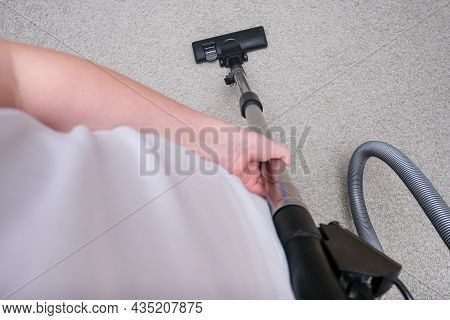 A Person Vacuuming The Carpet In The House, Cleaning Rug With The Vac Concept