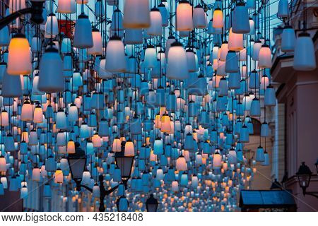 Street Lights On Stoleshnikov Lane. Moscow Pedestrian Street. Lights In The Dark. Beautiful Backligh