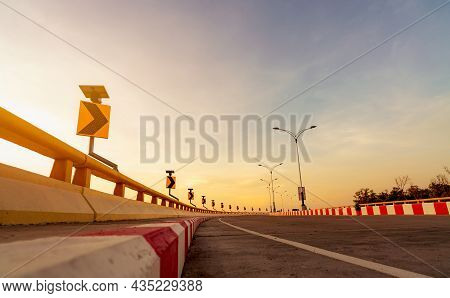 Curve Concrete Road With Curve Traffic Sign And Red-white Prohibited Stop Sign. Curve Road Beside Th
