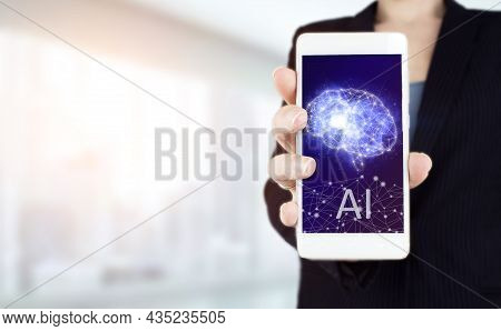 The Modern Concept Of The Cyberbrain. Hand Hold White Smartphone With Digital Hologram Artificial Br