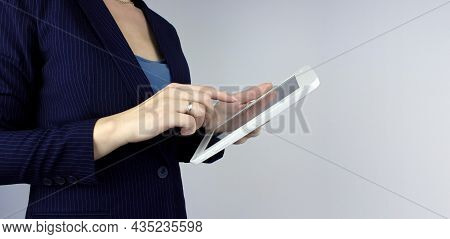 Digital Marketing. Woman Hand Held With White Digital Tablet On Grey Background. Hands Holding A Tab
