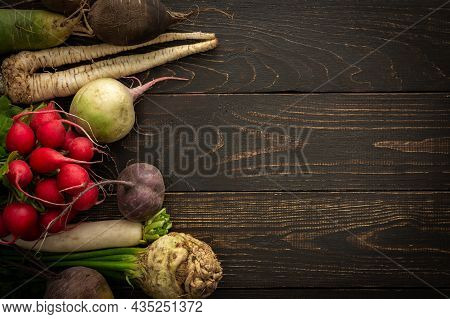 Root Vegetables On A Wooden Background
