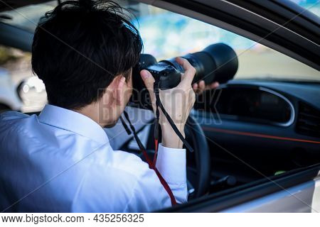 A Man Taking A Picture From Inside The Car