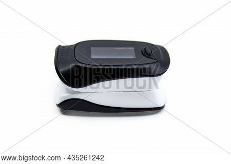 Pulse Oximeter Isolated On White Background. Pulse Oximeter Used To Measure Pulse Rate And Oxygen Le
