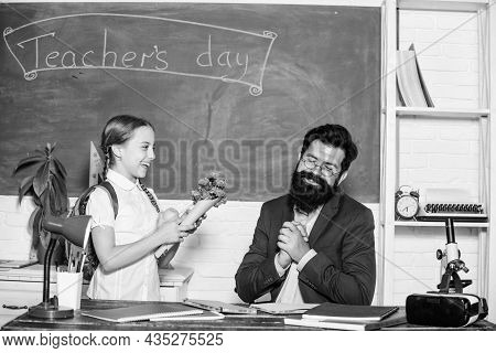 Back To School. Happy Teachers Day. Small School Girl Kid With Flower Bouquet. Teachers Day. Daugght