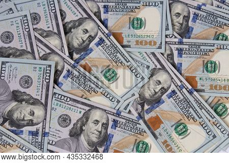 Background Of Hundred-dollar Bills. The Texture Of Hundred-dollar Bills. A Lot Of Dollars