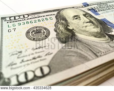A Stack Of Hundred-dollar Bills On A White Isolated Background. 100 Dollar Bills