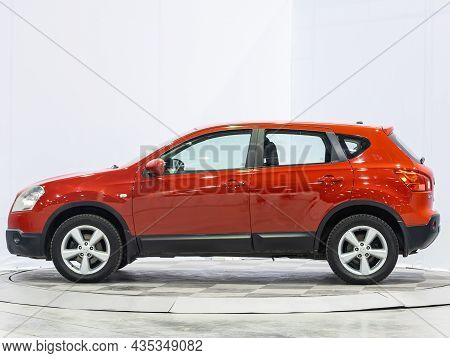 Novosibirsk, Russia - July 16, 2021: Red Nissan Qashqai, Side View. Popular Car On A Parking