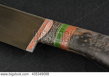 Decorative Oriental Knife On The Black Background. Bone Handle