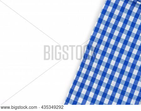 Top View, Close-up Of Blue And White Checkered Fabric Or Napkin On White Table Background. Concept K