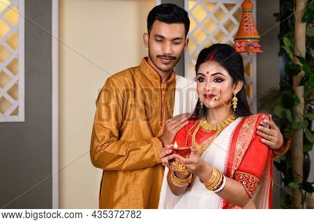 Portrait Of Indian Men Dressed In Kurta Pajama With Beautiful Indian Woman Wearing Traditional India