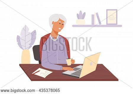 Happy Adult Woman Drinks Coffee And Using Laptop At Home. Smiling Elderly Lady Sitting On Chair At T