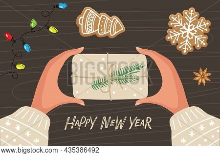 Two Human Hands Holding Box Wrapped In Kraft Paper With Decoration. Hands With Christmas Gift, Chris