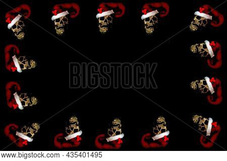 Christmas and Halloween Human Skull Picture Frame. Evil Christmas Skull. Human Skull with a Santa Claus Hat. Isolated on black. Evil Claus. Halloween Menu Board.