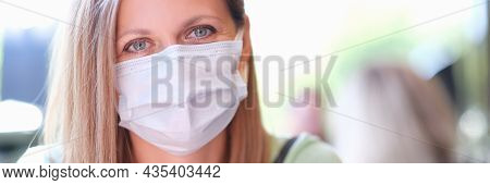 Portrait Of Young Beautiful Woman In Medical Protective Mask