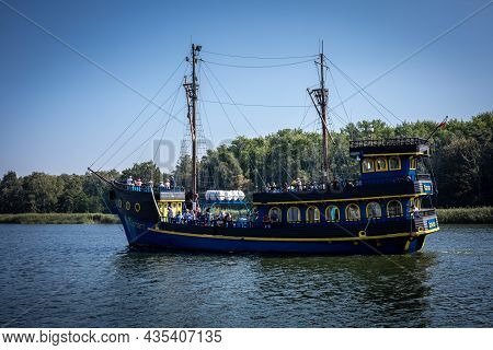 Dziwnow, Poland - September 10, 2021: A Blue Tourist Boat Sailing In Dziwna Channel.