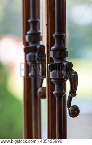 Very Ancient Bronze Handles On The Window